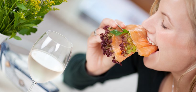 Lady eating salmon